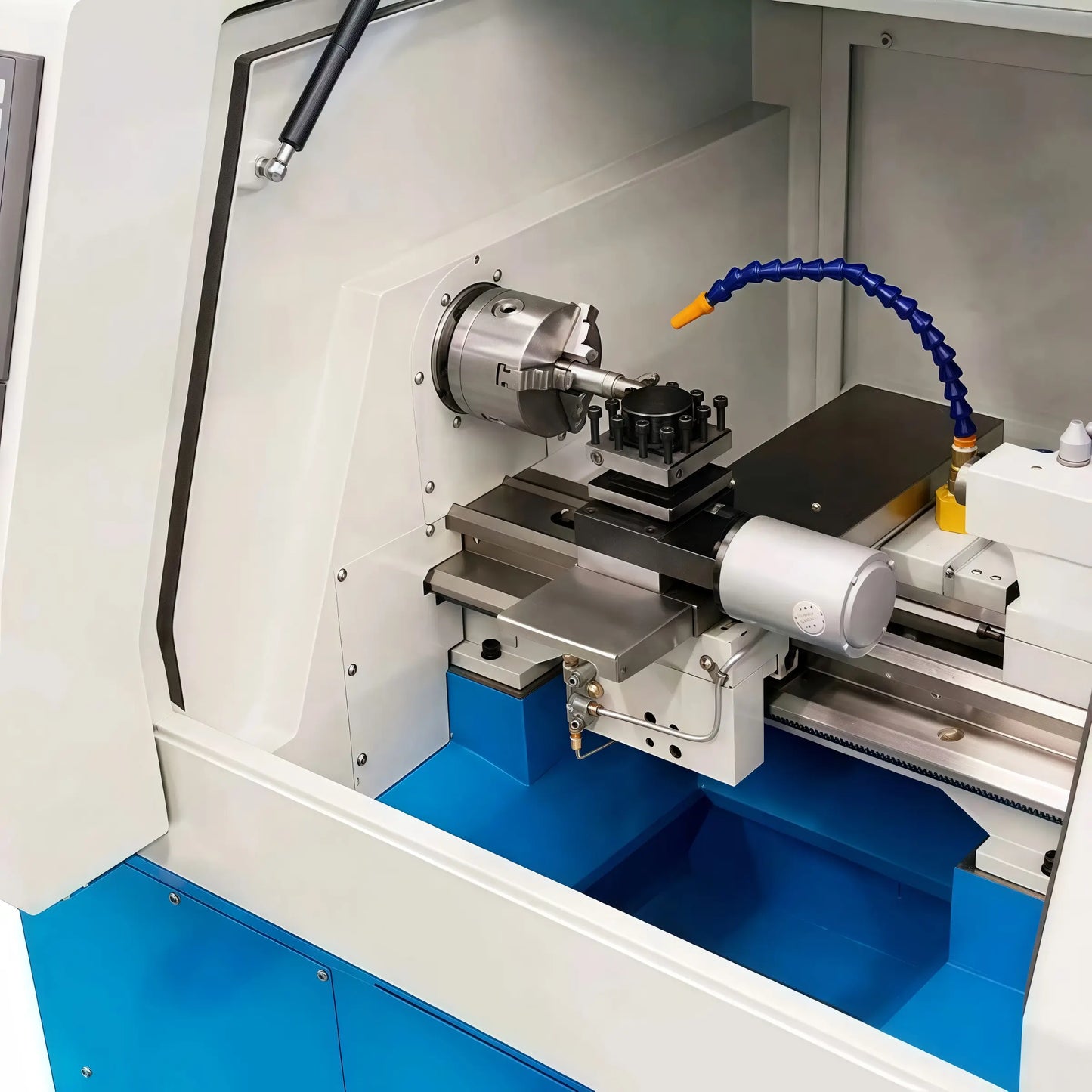 CNC210 Mini CNC Lathe by MicroNest - Internal Work Area with Chuck, Tool Post, and Coolant Nozzle